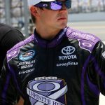 the infinite hero driver, wearing purple sunglasses, at Daytona Speedway