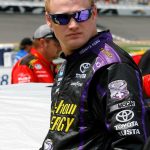 the infinite hero driver, wearing purple sunglasses, at Daytona Speedway