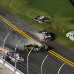 two cars, numbers 66 and 6 ,crash into each other at the Daytona Speedway